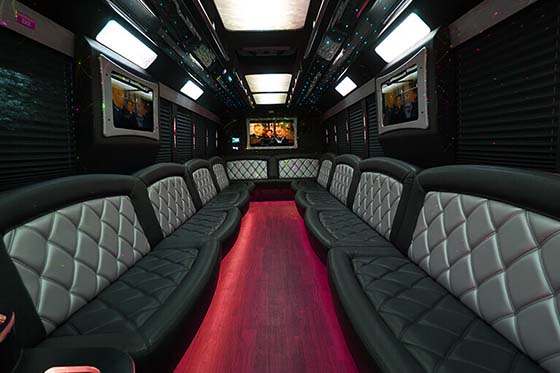 party bus interior with several tvs