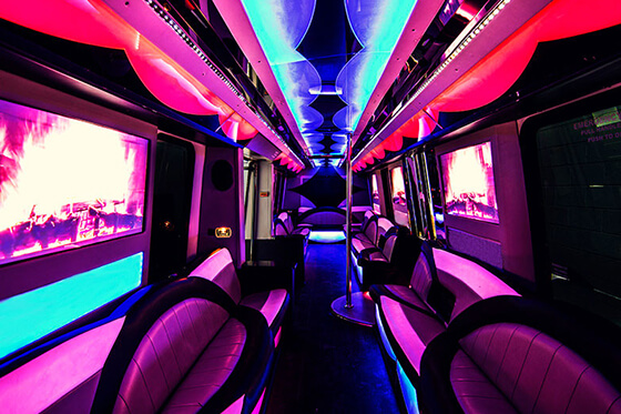 party bus interior with multiple tvs